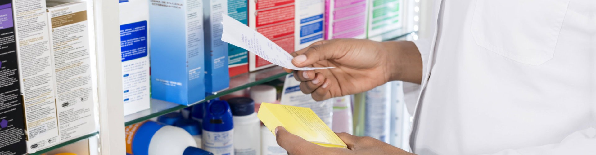 crop image of a pharmacist holding a prescription