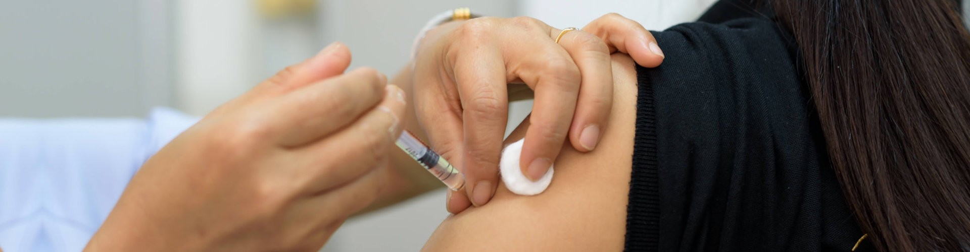 close up image of a woman getting her vaccine